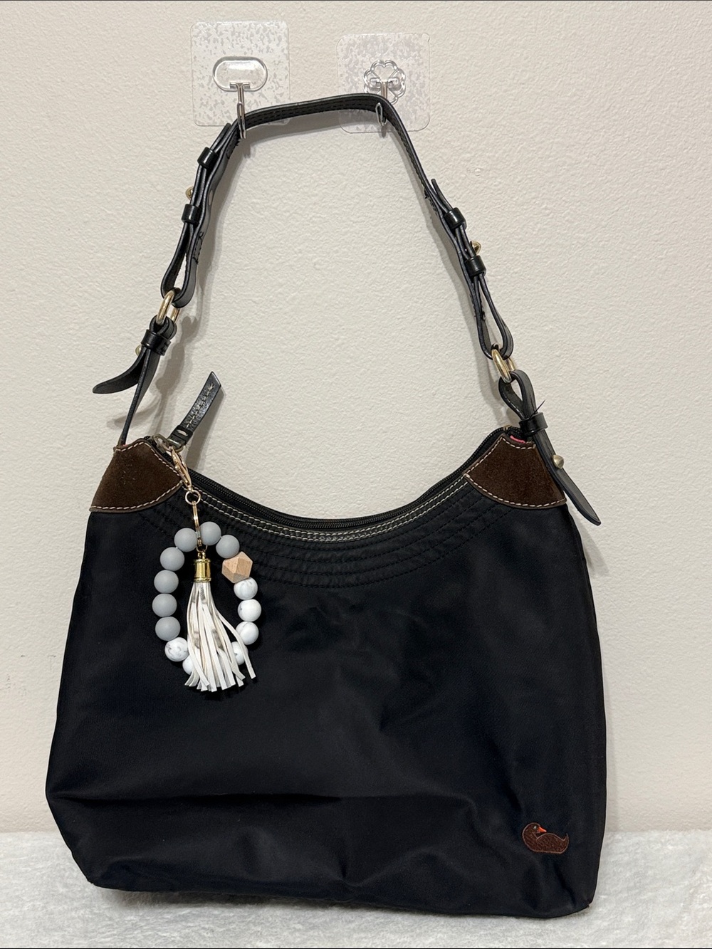 Dooney & Bourke Black Women’s Shoulder Bag with Tassel Charm